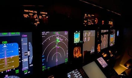 A web platform dashboard under review on a widescreen display